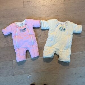 2 Gently used Baby Merlin Magic sleep suits size S and L